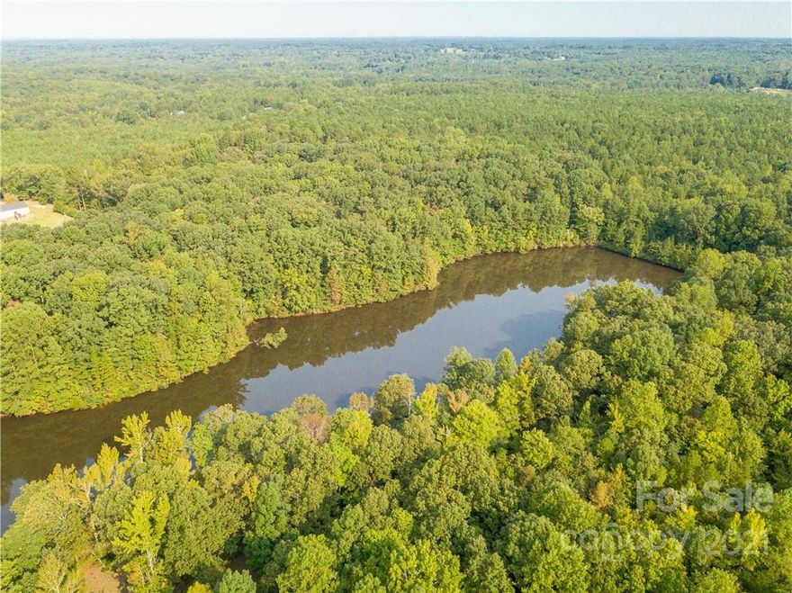 This 185 acres of land has breathtaking views of the beautiful countryside, which includes 17 acres of pastureland and a 4+ acre man-made lake.  The remaining acreage is wooded and great for outdoor activities. Think of the beautiful house site possibilities of this property! Property is taxed as 2 parcels 0070-00-038.00 and 0070-00-048.02 Property has over 300 feet of road frontage on Cimmeron Road and Adams Lane.
