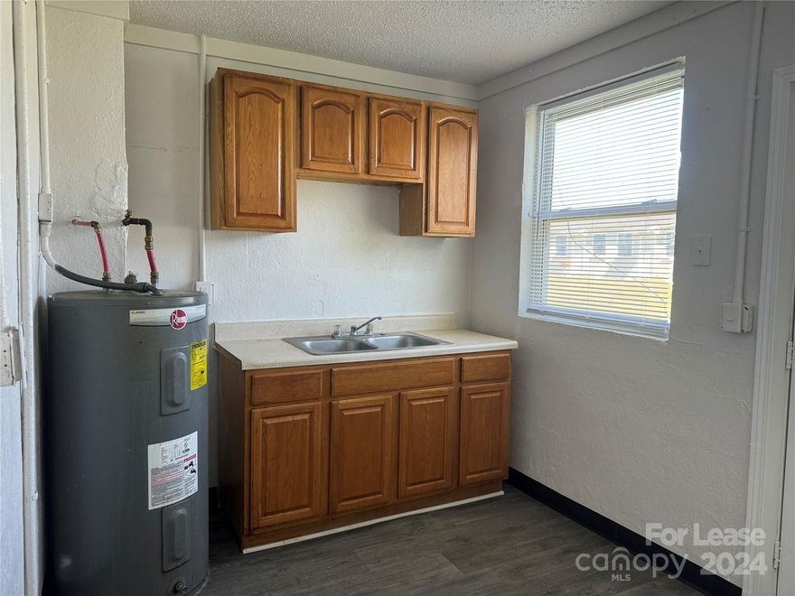 Updated two bedroom, one bath apartment! This home features brand new flooring throughout and fresh paint! Large living room leads to the open concept kitchen and dining area. Two good sized bedrooms, a full bathroom, and large storage room. Laundry facilities available in complex. Tenants are responsible for all utilities (electric and water.)
