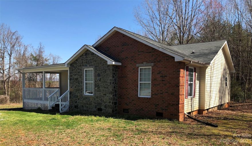 Enjoy small town living yet you are close to everything- dining, shopping! ! You'll love the year round distant mountain views from all 3 decks ( Front, Back & Side). This 3 bedroom/2 bath sitting on a wooded 1.16 acre corner lot offers so much: *all 3 bedrooms have their own large walk-in closets * Living Room is open to the Dining Room * Enjoy relaxing on the large covered front or back porch- you choose! * Laundry / Mud Room off the Kitchen  * Lots of closets for storage  * Breakfast Bar in the Kitchen * Plenty of parking - can easily park 3-4 cars- even room for an RV!