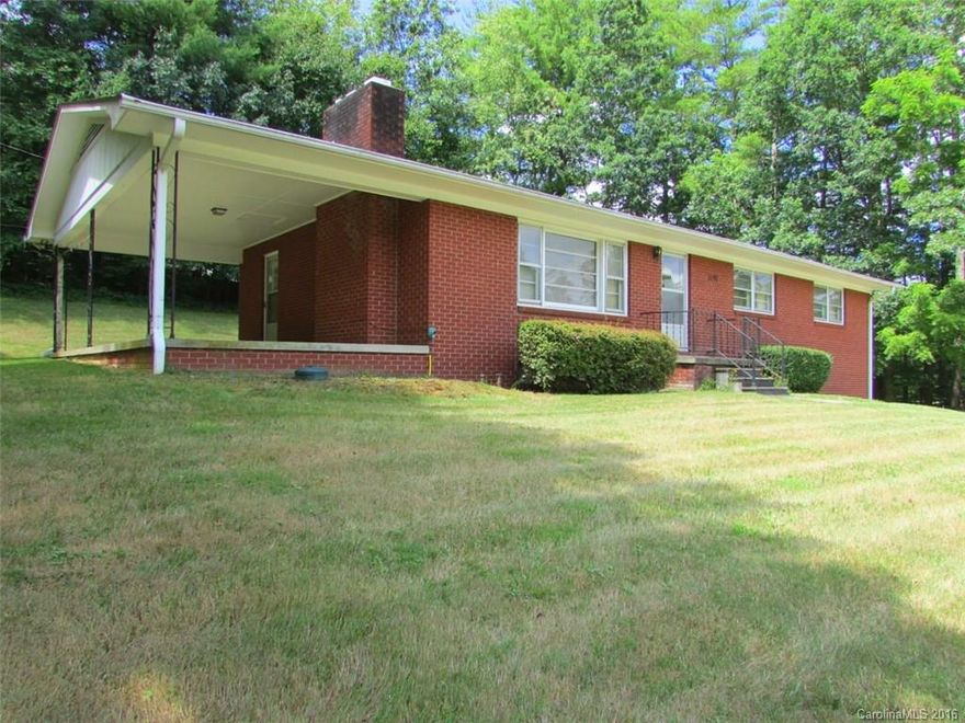 Rock solid Brick Home in the heart of Fairview. 3Br/2Ba with Original Hardwood Floors, (some hardwoods under carpet), great space in unfinished basement with wood burning fireplace to finish as a family room, rec room. Sliding glass doors in kitchen lead to a Level Backyard for kids&pets to play that backs up to woods! Perfect for a large deck! Inside access to basement, double garage to keep vehicles out of weather. Also could be used for commercial office space! Tremendous traffic count.