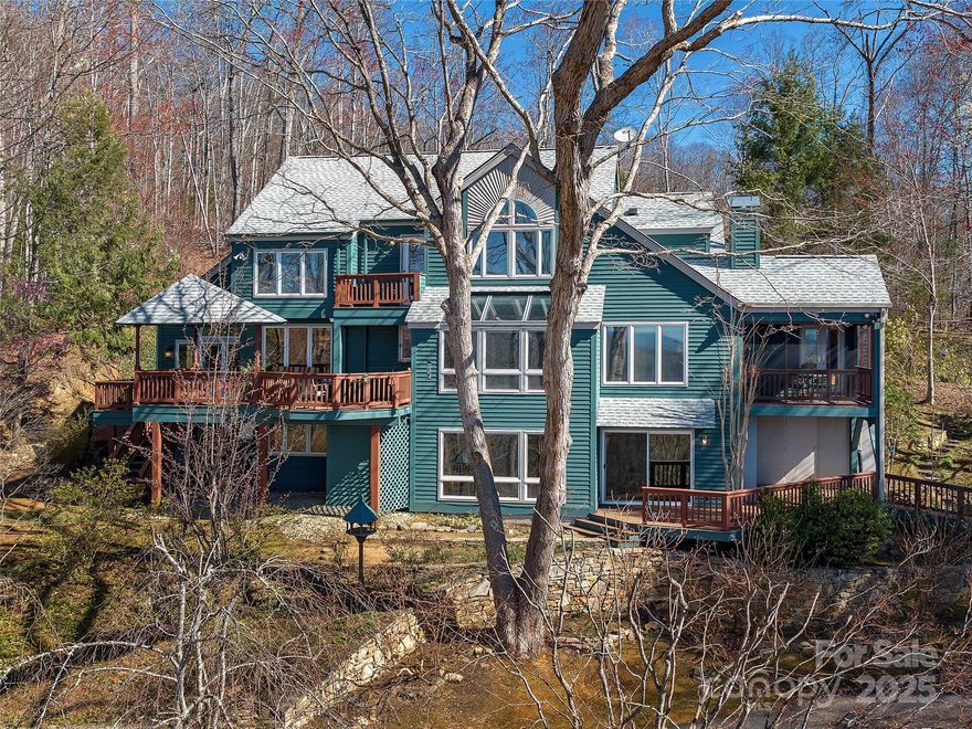 Nestled on nearly 5 acres of pristine land, this stunning, one-owner post and beam custom home offers a
rare combination of breathtaking long-range mountain views and unrivaled privacy. Designed with an eye for
detail and artistic flair, this expansive home features inviting gathering spaces and serene, quiet nooks.
The heart of the home is the open kitchen, beautifully renovated in 2018, which flows seamlessly into the
cozy family room. Step out onto the screened porch to further immerse yourself in the surrounding natural
beauty. Polished hickory floors add a touch of elegance. Sweeping panoramic views from impressive decks
that extend the living space outdoors. For the energy-conscious, two Tesla batteries & solar panels ensure
sustainability & efficiency. Western cedar siding exudes rustic charm & durability. Rare three-car garage
& wood shop. Finished basement complete with wet bar & bath - perfect for hobbies, fitness, work &
play. What an idyllic setting!