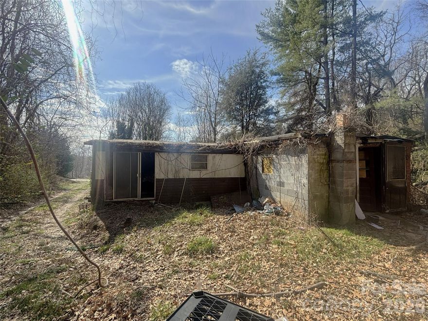 Investors alert!! Great location for investors, located just 5 minutes from Patton Ave, some flat areas. A very small stream runs through the property. House is SOLD AS IS. Per seller information the septic tank is located at the front of the house, facing the street. House is vacant. Several buildings on the property, all of them need to be repaired. Entering to the house at your own risk, floor is unstable, buildings are full of usless items so please take a flash light. For appointment call Showing Services.