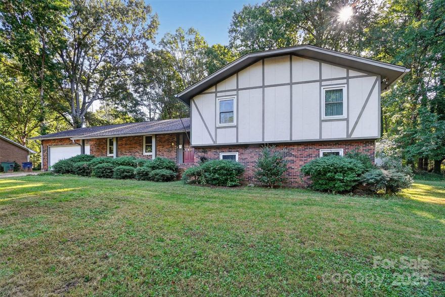 Welcome to your next home in the heart of Lecho Park, a charming and growing neighborhood in Conover that perfectly blends comfort, space, and character. This spacious 4 bedroom 3 bath home was built in 1976, and offers a plethora of space, approximetly 2,545 square feet of living space with lots of room for everyone, hardwood floors throughout the main level with a modern updated kitchen, which opens to dinning space. Relax on the screened in porch overlooking the landscaped backyard with mature trees and flowers. the lower lever features a fireplace, bar area and an additional bathroom, which includes your own personal sauna-perfect for entertaining or family gatherings.