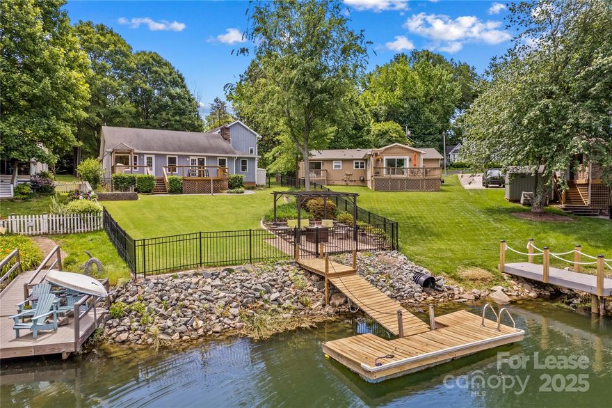 WATERFRONT AND FULLY FURNISHED home in the desirable lakefront community of Bahia Bay in Cornelius, NC. This 4-bedroom, 3-bath home offers WATERFRONT living at its best. The open floor plan features cathedral ceilings, a Great Room, an open Kitchen with a large island perfect for entertaining, and a Dining area, all with lake views. Step outside to a well maintained backyard with a deck and private dock—ideal for enjoying sunsets or setting out for a day on the water. The community amenities include access to a boat ramp, day dock, and picnic areas. ALL UTILITIES, GARBAGE COLLECTION, AND LAWN MAINTENANCE ARE INCLUDED! No Smoking and Pets are conditional with a $350.00 non-refundable pet fee. Flexible lease terms available for 3 or 6 months. AVAILABLE NOW!