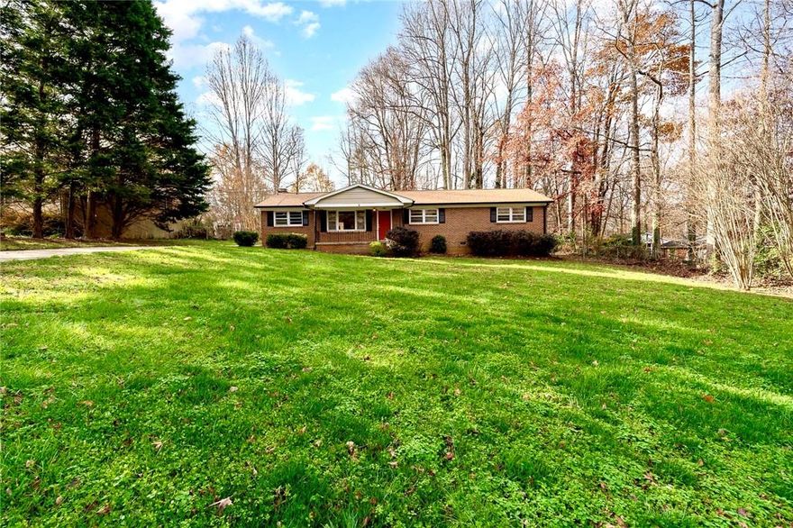 Full Brick ranch home. NO HOA, on just about 3/4's of an acre.  Heart of Gastonia & Mins from I-85 . Featuring a spacious open concept, one story living.  Near shopping and restaurant areas. Less then 1/2 hour to Charlotte's city center. Fenced in yard in the back with storage shed, but also has an ample covered front porch. As you enter your new home you'll be welcomed by ample living room that transitions into your dining area, family room and kitchen. The kitchen comes fully equipped with Black appliances, island & plenty of cabinetry space. Beautiful wood and laminate flooring covers all living areas and primary bedroom, while the  guest rooms sport comfy carpeting. The home has had a new roof and HVAC system installed within the past 3 years, and yes even the Washer and Dryer are available. Don't wait! This home is your forever home!