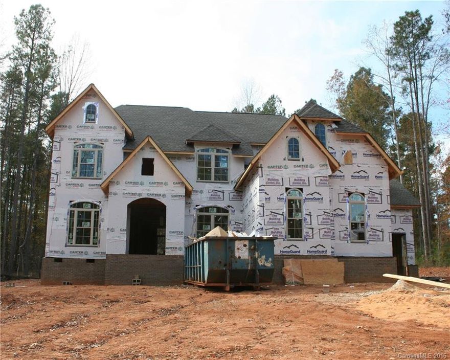 Perfect timing! Truly custom Lake Wylie gem on large wooded lot with water views.  Master bedroom with sitting area, dream bathroom, and huge Master closet.  Framed, wired, and awaiting your selections.  Plans include 2 gas fireplaces, one in great room, and one in keeping room, off kitchen.  Den with closet on main level. Custom moldings & built-ins throughout.