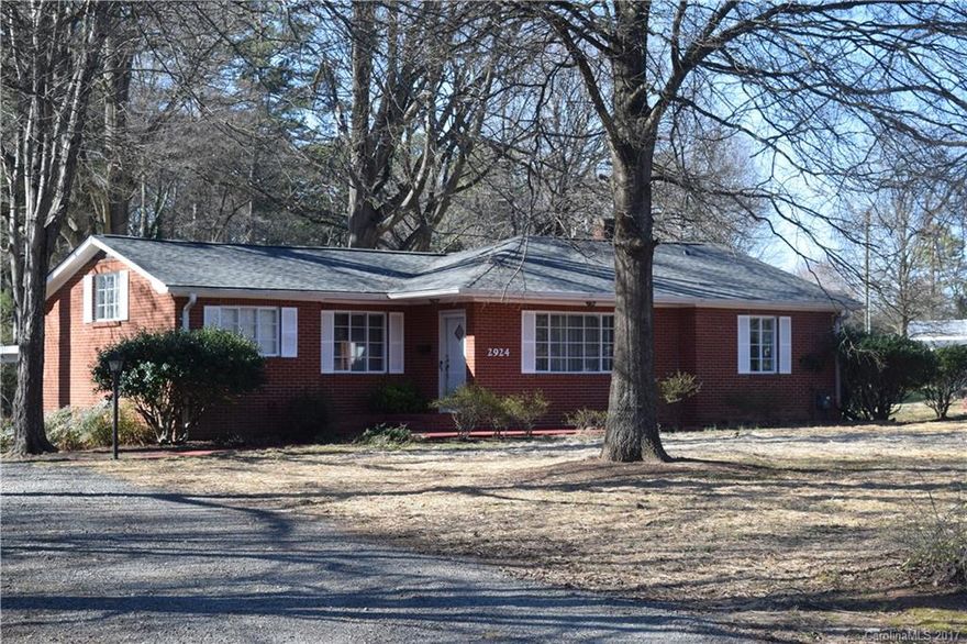 Total Acreage 1.18 includes  tax parcel 055-263-03  Fresh paint in and out  new roof on house and outbuildings 24x24 barn with loft 12 x 24 shop,  living room with fireplace,  separate  dinning room and den  updated carpet move in condition.  Updated kitchen with appliance