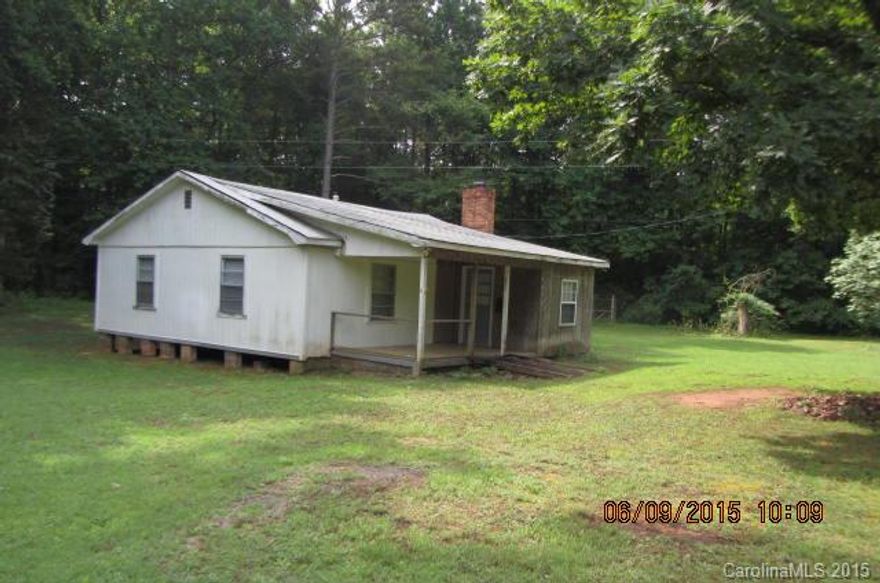 2 buildings on this lot. One is an old farm house, other one is a newer 20x40 building that was used as pottery showroom/shop at one time and can be converted into a house. Old farm house needs TLC. Beautiful 2.61 acre partially wooded lot. Various other small buildings on the lot. Value is in the land. Great location and lots of potential.