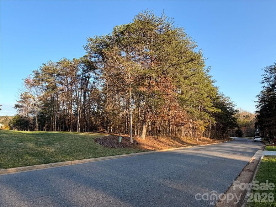 Back on the market at no fault of the seller, this .62 golf course facing lot sits directly along the fairway at Lake Hickory Country Club’s Catawba Springs course, offering daily front-row views of one of Hickory’s premier private golf facilities. It's next door lot (3785) can be combined for a larger 1.2 acre estate lot if desired.  Tucked into the established Catawba Springs Golf Community in northeast Hickory, the lot combines a peaceful residential feel with the convenience of being inside the city limits and just minutes from shopping, dining, and major roads.

Wake up to manicured fairways, mature trees, and the quiet rhythm of play unfolding just beyond your backyard as golfers finish out the hole in full view. Instead of driving to find green space, you can enjoy your morning coffee on a future patio or screened porch while watching approach shots, putts, and sunsets over the course. Evening walks follow tree-lined streets where many homes are positioned to take advantage of golf views, creating a neighborhood atmosphere that feels relaxed, social, and connected to the outdoors.

Life here is centered around Lake Hickory Country Club, which operates two facilities and describes itself as the premier private country club in Hickory with a “best in class” experience across golf, tennis, fitness, dining, and social amenities. At the Catawba Springs campus, members enjoy 27 holes of private golf, a full practice facility, and a clubhouse that serves as a social hub for dining, drinks, and events. Food and beverage service includes bar, grill, and restaurant offerings, and the club also provides meeting and banquet facilities for gatherings, celebrations, and special occasions.

Beyond the course, active living is supported by additional club amenities such as tennis, fitness, and organized programs for members. The club’s fitness center features aerobic machines, free weights, an indoor racquetball court with viewing area, men’s and ladies’ locker rooms, and steam or sauna facilities, along with classes like spin, yoga, and conditioning to make wellness a natural part of your weekly routine. Tennis and pickleball options, along with social events and junior activities, round out a lifestyle where it is easy to stay engaged without leaving the community.

Catawba Springs is governed by recorded bylaws and covenants administered by the property owners association, which are designed to preserve the neighborhood’s appearance and protect long-term property values. Owners planning to build or add improvements must also follow the City of Hickory’s land development and building regulations, with the more restrictive of the city or community rules applying, helping to maintain a cohesive streetscape and a well-kept environment around the golf course. Nearby golf community listings highlight city water, sewer, trash, and street lights, along with wired connectivity options, underscoring the blend of resort-style setting and practical everyday infrastructure in this part of Catawba Springs.

With its direct fairway frontage, private-club setting, and access to a full slate of country club amenities, this lot offers an ideal opportunity to design a custom home that feels like a year-round getaway—whether you are hosting friends after a casual round, watching the last group finish as the sun goes down, or simply enjoying the quiet beauty of living right on the golf course.