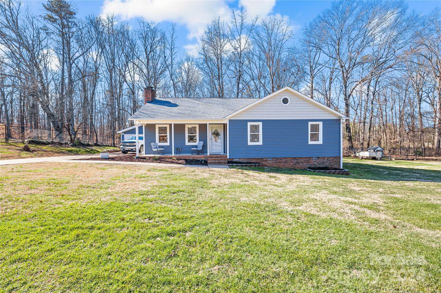 Looking to be close to Charlotte, but also like the quiet country feel?  This 3 bed/2 bath, 1 owner home is ready for you!   The sellers have put a lot of love into the home including fresh paint and floors throughout making it turnkey for the next owners to enjoy.  Updated kitchen featuring new cabinets, black appliances, and quartz countertops. 
The flat lot is fully fenced in with a remote-control electric gate, detached 2 car garage, and 12x16 storage building.  Enjoy the peace and quiet on a dead-end street with no HOA.  Roof is approximately 3 years old and HVAC approximately 8 years old.  Very convenient to Charlotte and the airport, this home will not last! Professional photos and measurements by February 3rd.  Measurements are approximate by tax records.