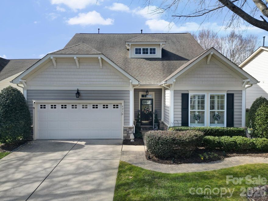 STUNNING! UPDATED! PRIME LOCATION! This beautiful home tucked away on a quiet cul-de-sac street is a must-see GEM! From the minute you walk in, graceful archways, architectural nooks, new white oak flooring, and exquisite molding exhibit timeless charm at every turn. This 3-bedroom, 3-bath home offers plenty of flexibility with a multitude of living areas including a flex space, ideal for an office, craft room or even an additional bedroom.

The spacious living room flows seamlessly into an open-concept dining area and features a cozy gas log fireplace and a wall of windows allowing for maximum natural light. Walk out the living room through french doors onto the screened-in porch with cooling ceiling fan and privacy shades. 

The updated kitchen has that WOW factor!  Beautiful and functional featuring high-quality white cabinetry with roll-out shelves, stainless steel appliances, stunning tile work, eat-in dining space and an open archway that provides a lovely view of the main living area. 

The primary suite is conveniently located on the backside of the home overlooking the tranquil backyard. Featuring a trey ceiling, ensuite bath with dual vanities, glass shower and custom walk-in closet. Guest suite is situated at the front of the home with access to a full hall bath. Upstairs, you’ll find an additional suite with full bath and  a loft - ideal for visiting guests or multi-generational living.
Additional highlights include a generous walk-in attic, a large storage closet under the stairs, and an extra utility sink in the garage installed in 2025. 

Enjoy outdoor living at its finest on the expansive stone paver patio overlooking the thoughtfully landscaped yard featuring a new fence (2025), irrigation system with drip lines for newer plantings, and a convenient stone pathway from the front yard to the backyard. 

This charming home offers inviting curb appeal, mature landscaping, and tree-lined streets in the highly desirable Indian Land area. Within walking distance to the neighborhood pool, clubhouse, and local grocery store.
Conveniently located to the new Target, Costco, YMCA, restaurants, medical and banking, this home combines comfort, style, luxury and an unbeatable location.  ***Make sure to check out the FULL list of updates and upgrades in attachments.