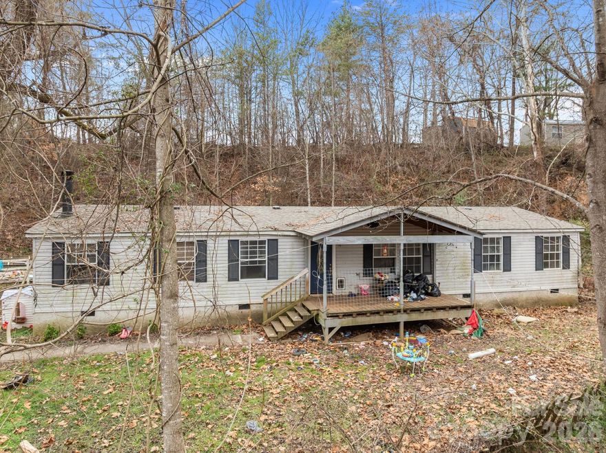 Located at 53 Twin Ridge Dr. in Weaverville, NC 28787, this fixer-upper offers strong potential for investors or buyers ready to add value. The home features two additional rooms that have been added on, providing extra space and flexibility for future improvements, home office use, or guest accommodations. The property also includes a shed and a chicken coop, appealing to those seeking storage, hobby space, or a more self-sufficient lifestyle. Nestled in a quiet setting just minutes from downtown Weaverville, the home offers convenient access to local shops, restaurants, and community amenities, with the Blue Ridge Parkway and Asheville only a short drive away. A great opportunity to renovate and customize in a desirable Western North Carolina location.
