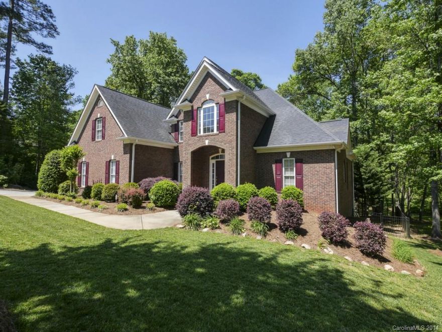 Unbelievable deal!  Gorgeous 5 BR/4 BA full brick home in Wedgewood features formal dining, vaulted family room, 2 fireplaces, guest bedroom w/ full bath on main, huge bonus room, and finished basement w/ endless possibilities for a rec room, office, addtl bedrooms, and more!  Master on main w/ hardwoods, double tray clgs, and vaulted bath w/ huge walk-in closet.  Sprawling deck overlooks fenced yard and peaceful wooded views!  Priced to sell!  Don't miss this rare opportunity!