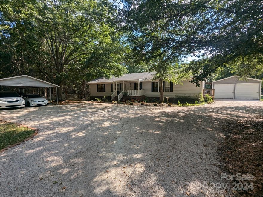 Discover this move-in-ready house nestled in a peaceful neighborhood, boasting a fully fenced level yard, large garage, and a 4-car carport. Enjoy the spacious deck and screened-in porch, perfect for relaxing or entertaining. Situated three minutes from I-77, this property offers both tranquility and accessibility. Schedule your showing today!