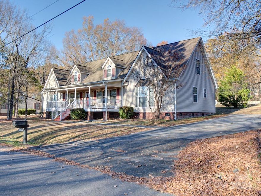 This charming & spacious home in Rock Hill is just minutes from shopping, dining, the interstate, & less than an hour from Downtown Charlotte. Situated on a large lot, it's ready for any size family. A large southern-style front porch welcomes you home. As you enter, you're greeted by a dining room & a large family room w/ a cozy fireplace. You'll also find ample storage space & closets. There are 3 bedrooms downstairs, including the primary, & 2 full bathrooms. The guest bathroom is complete w/ a step-in tub/shower combo. The large kitchen is the heart of this home & boasts recessed lighting, an island w/ a breakfast bar, ample cabinet & counter space, & a pantry for additional storage. Also downstairs is the laundry room w/ a closet & utility sink. Upstairs there is a very large bonus room, bedroom, & a full bathroom. It's the perfect spot for guests or just a great hangout spot. Out back you'll find a deck perfect for grilling. Come check out this wonderful home, today!