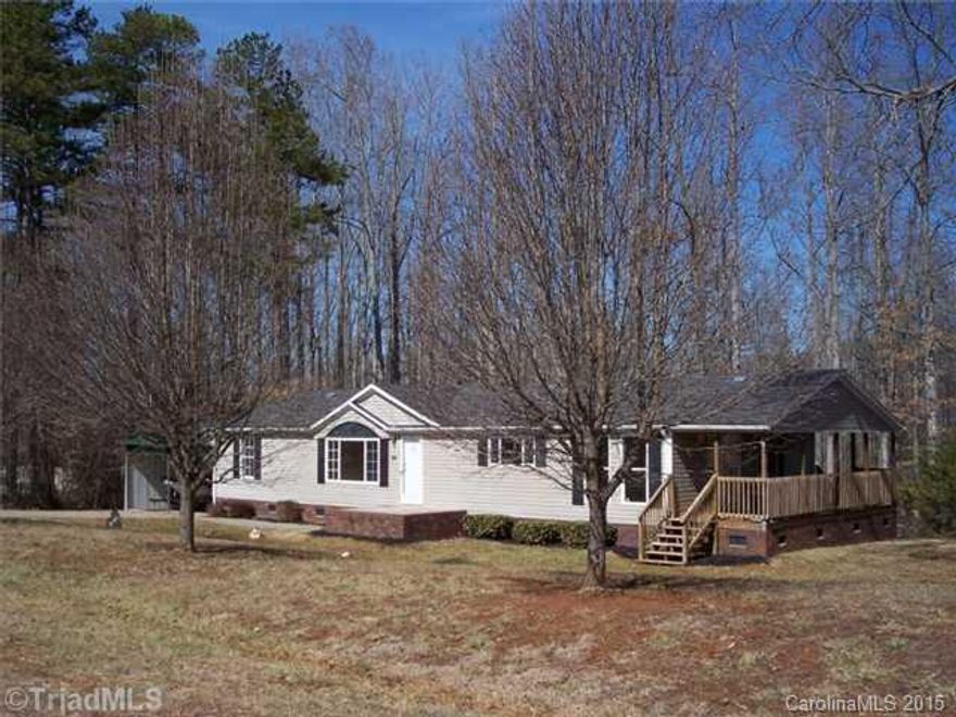 Move right in. Freshly painted throughout the interior, new carpet, range, refrigerator, dishwasher and microwave stay. Wonderful covered porch off of dining area, small porch off laundry room, large two car carport, concrete drive, brick underpinning. Property behind this home is wooded giving you a feeling of privacy in the back yard.  This home is immaculate.