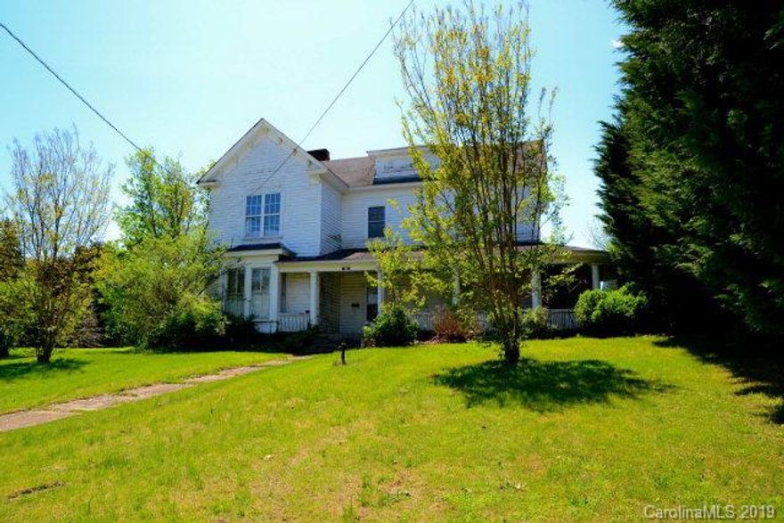 ***Possible Owner Financing*** Go back in time...with this rare opportunity to own a piece of downtown Marion NC history.  The house needs some TLC, but could be restored back to a treasure from yesteryear.  Large front porch for porch sitting, Master on the main level, three bedrooms upstairs, large eat-in kitchen, living room, laundry room, large flat lot that fronts on Morgan St. and Willow St.   ***CAUTION*** the front porch and some of the flooring may not be safe...BE CAREFUL***