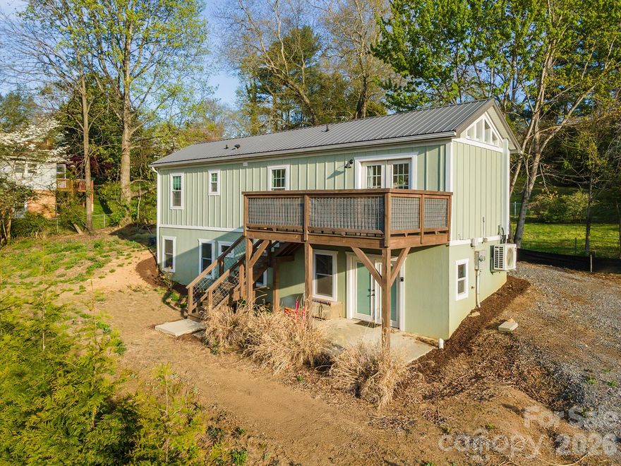 Mountain views, proven short-term rental income, and a walkout basement ready for future potential, all less than a mile from downtown Black Mountain.

This thoughtfully designed 2021 mountain home offers south-facing exposure and sweeping views of Jesse’s Hightop and Black Knob Peaks, filling the home with natural light throughout the day. Just a short drive to Asheville, the location combines mountain setting, small-town charm, and easy access to one of Western North Carolina’s most vibrant cities.

The main living space features natural wood floors, vaulted tongue-and-groove ceilings, and an open layout that feels warm, inviting, and connected to the surrounding mountains. The kitchen includes custom quartz countertops and flows comfortably into the living area, creating a welcoming space for gathering after a day exploring the trails, restaurants, and shops that make Black Mountain such a beloved mountain town.

The flexible layout includes a bedroom with office space, a custom reading loft, and a bright primary suite, making the home well suited for full-time living, a mountain retreat, or continued rental use.

A standout feature is the fully separate walkout basement built with Superior Walls, offering windows, exterior access, plumbing stubbed for kitchen and bathroom (shower/lav/toilet), and a transferable Superior Walls warranty. The space provides exceptional potential for a guest suite, artist studio, recreation room, private apartment-style living area, or expanded rental opportunity, giving buyers the ability to create additional value over time.

With mountain views, proven rental performance, and room to grow, this property offers a rare opportunity in one of Western North Carolina’s most desirable mountain communities. Conveniently located near Montreat, Blue Ridge Assembly, and Asheville, it provides easy access to both nature and culture while remaining close to the heart of downtown Black Mountain.