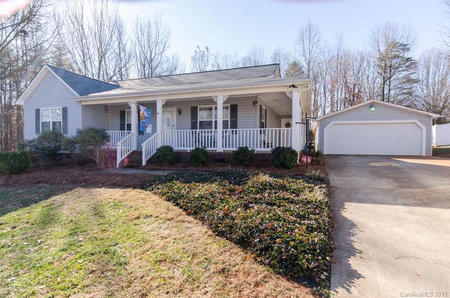 Don't miss this one! 3 bedrooms, 2 bath, covered front porch, oversized detached 2 car garage, fenced back yard, new laminate floors in the living room and hall, ceramic tile in the kitchen, stainless appliances, and so much more!  An absolute must see!  This is what curb appeal is all about. Property conveniently backs up to Iron Station Elementary.