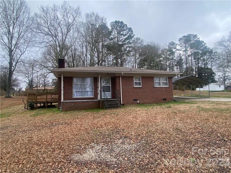 This brick home is located in the Elgin community and in close proximity to 521.  Features also include  2 br, 1 bath, covered front porch, side deck, large living area & storage shed.  With a little love this home can be quickly updated.