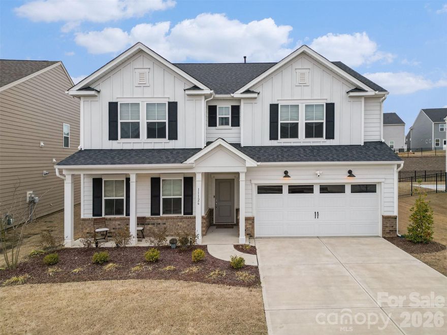 Welcome to this beautifully designed home in the desirable Parkside Crossing community, where modern style meets everyday functionality in one of Charlotte’s most convenient and fast-growing areas. With its charming front porch, clean architectural lines, and welcoming curb appeal, this home makes a strong first impression from the moment you arrive.

Inside, the open-concept layout creates a seamless flow between the main living spaces. The bright and airy family room opens to a spacious dining area and an expansive kitchen centered around a large island, making it ideal for entertaining or gathering with family. Light finishes, abundant windows, and durable flooring throughout the main living areas give the home a fresh, contemporary feel. Just off the foyer, you’ll find a full bedroom and full bathroom on the main floor, offering incredible flexibility for guests, a home office, or multigenerational living.

Upstairs, the generous primary suite serves as a private retreat, complete with a spacious bedroom, spa-like bath with dual vanities and a garden tub, and an oversized walk-in closet. Additional bedrooms and a versatile loft provide room to spread out, whether you need space for work, play, or relaxing evenings at home. A large backyard offers plenty of room to create your ideal outdoor living space.

Parkside Crossing enhances the lifestyle even further with neighborhood amenities that include a community pool, cabana, playground, and dog park, creating opportunities to connect, unwind, and enjoy the outdoors. 

Located in the sought-after 28278 area, this home offers easy access to shopping, dining, Lake Wylie, the Palisades area, and major roadways for a convenient commute into Uptown Charlotte. Combining space, flexibility, and a prime location, this home delivers the perfect balance of comfort and community.