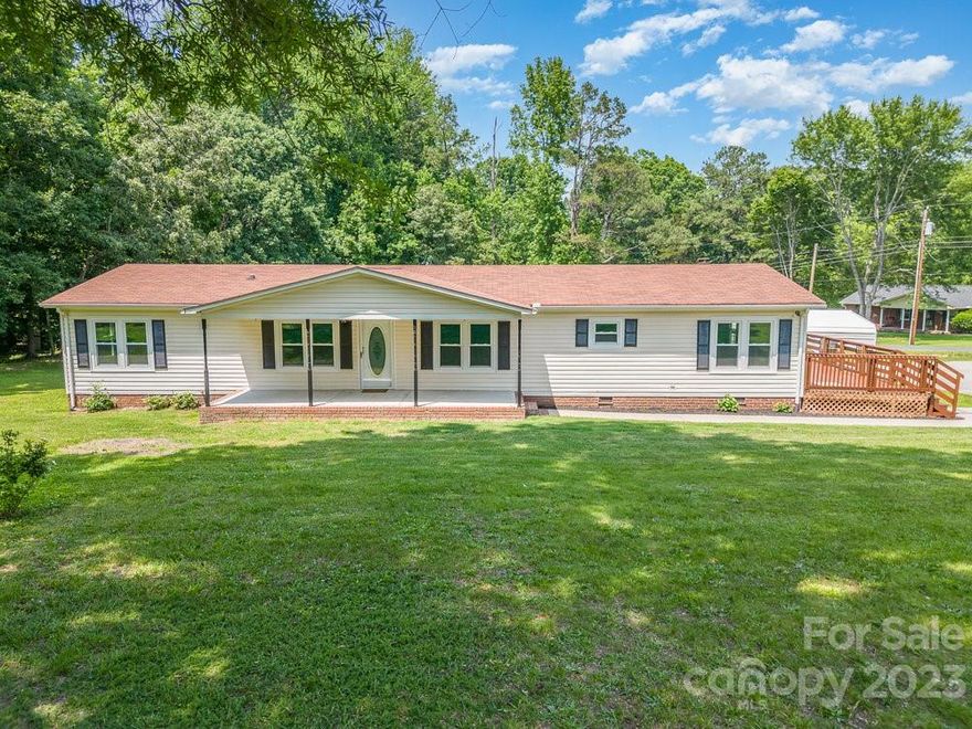 Newly renovated home located in a quiet country setting on 3 acres.   Home boasts beautiful new LVL flooring, electrical, lighting, windows, HVAC, and Paint. The home has a large front porch ready for a porch swing and two large decks for relaxed outdoor living.  Covered parking will accommodate two full size vehicles.  This property consists of two parcels, 1 acre with the house and two wooded acres with a spring running through the propertied.  .  This land has options to divide or keep as is.