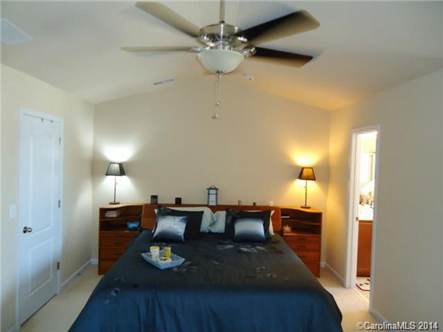 This gorgeous home is only 4 years old. 2 Car Garage, nice deck to relax on. Separate garden tub and tiled shower in master bathroom with dual vanities. Park setting across from this unit to walk or just relax on a park bench. Gas heat and hot water. Great schools in the area. Library, doctor offices, day care, shopping, dining - all withing walking distance. Stainless steel appliances.