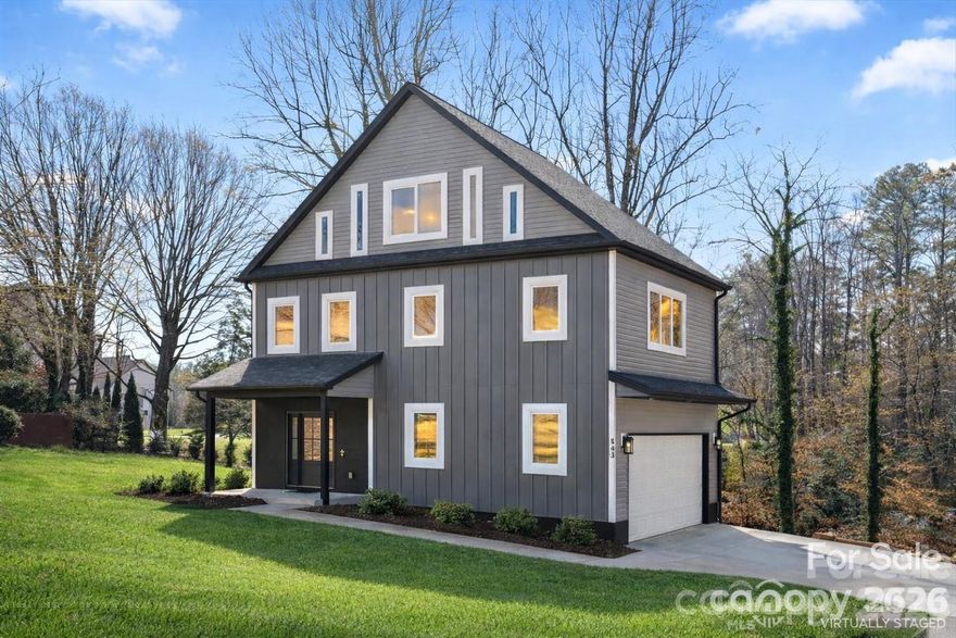 Stunning new construction in the heart of Viewmont — 3 bedrooms, 4 full baths, and 3,000+ sq ft of thoughtfully designed living space across three levels. The open main level impresses with designer finishes, a chef's kitchen with quartz countertops and custom cabinetry, and a private bedroom suite perfect for guests or a home office. Upstairs, the spacious primary suite offers a spa-like retreat alongside a second bedroom, full bath, laundry, and a large family room ideal for everyday living. The third-floor loft with private bath is a standout — use it as a media room, gym, executive office, or guest suite. Enjoy the back porch and unbeatable walkability to Lake Hickory, dining, shopping, and the Viewmont Farmers Market. Modern design. Quality craftsmanship. Prime location.