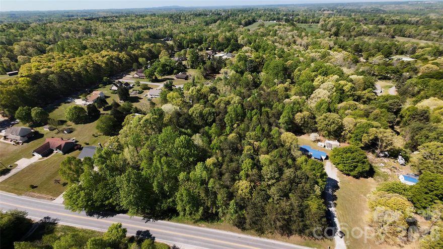 Development Potential in Kings Mountain-Utilities in place-Zoned RM-
Opportunity meets flexibility with this 11.5-acre property offering Residential Multifamily zoning—ideal for a small mobile home park, multiple homesites, or a private estate with room to expand.
The property includes a 2 bed / 2 bath single-wide currently in place, along with well and septic already installed, allowing for immediate use or rental income while future plans are developed.
The land features a mix of wooded acreage and natural terrain, providing privacy while still offering multiple potential build sites. With road frontage on Stony Point Road, access is convenient for future development.
Whether you’re looking to create income-producing property, develop multiple lots, or secure land with long-term upside, this property offers a rare combination of utilities, zoning, and acreage.