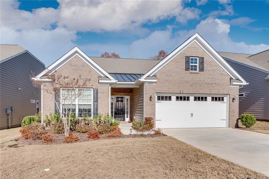 Great ranch floorplan with open layout in Carolina Reserve. Hardwood floors flow throughout the entire home.     Kitchen features stainless appliances, granite countertops, tile backsplash, island, pantry, and ample space above cabinets perfect for decorating. Separate dining area with wainscoting is a great place to host family dinners or entertain guests while gathered around the fireplace in the great room. The covered back patio with  extended landscaping & wooded view makes this lot ideal.