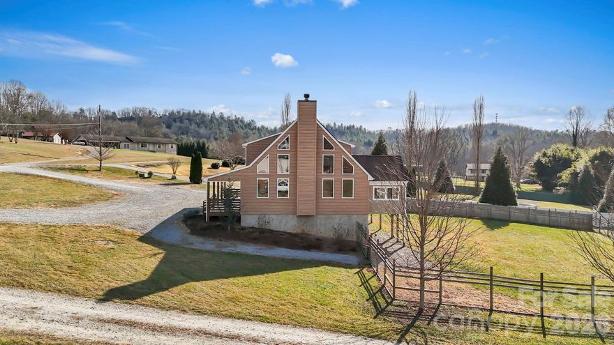 Rare VA Assumable Loan Opportunity at 3.875%! Discover the perfect blend of privacy, flexibility, and convenience at 40 Forge Valley Drive in Mills River. Situated on a level, fully fenced 1.3-acre lot with no restrictions, this property offers endless possibilities for full-time living, multi-generational use, or investment potential. Conveniently located in Mills River, you’re close to shopping, dining, breweries, and major routes while still enjoying a peaceful, country feel. Less than 20 minutes to downtown Brevard, Hendersonville, or Airport Road area in South Asheville!
The home features a separate basement entrance, ideal for a potential mother-in-law suite, guest space, or private living area. Outside, the expansive yard provides ample room for gardening, pets, recreation, or future improvements—made even more appealing by the freedom of unrestricted land use.
Solar panels are already installed, providing energy efficiency and long-term savings.