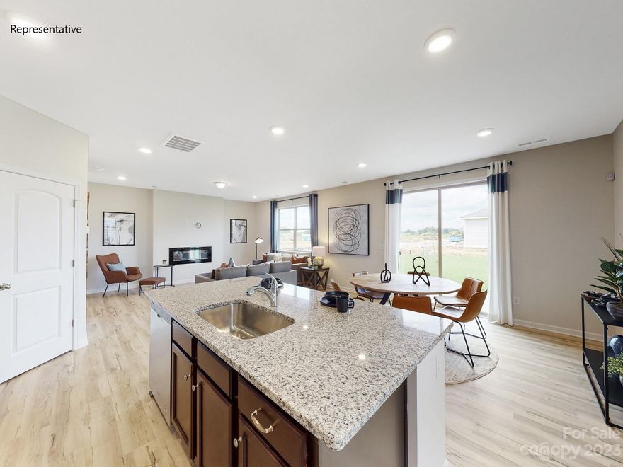 The Kephart floorplan is a spacious and well-designed home encompassing 1939 heated square feet. It features a thoughtful layout with three bedrooms and two and a half baths, offering ample space for comfortable living. The floorplan emphasizes an open concept, creating a seamless flow between different areas of the house. The family room is adorned with an electric linear fireplace, providing both aesthetic appeal and a cozy atmosphere. Adjacent to the family room is the kitchen, which boasts elegant granite countertops and an island. Upstairs, you'll find a loft area, perfect for use as a recreational space, home office, or additional seating area. This Kephart floorplan is located within a community that provides a variety of amenities. Residents can enjoy a refreshing pool, ideal for leisurely swims or socializing with neighbors. Additionally, a pavilion and cabana are available, offering spaces for outdoor gatherings, picnics, and entertaining.