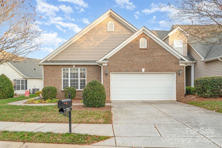 A beautifully maintained end unit townhome in highly desired 55+ community with endless amenities! Home is situated on a small corner property providing you added green space and privacy on your personal back patio. Inside welcomes you with formal dining area on the left and formal living room on the right, the perfect space for a library or home office. Continue into the family room with vaulted ceiling, focal gas fireplace and tons of natural light that is open to the spacious kitchen. Kitchen has tons of natural wooden cabinets, matching black appliances, and breakfast nook + bar seating providing plenty of options when hosting family & friends. Primary bedroom also has tall vaulted ceilings. Ensuite includes dual sinks, soaking tub, glass shower & large walk-in closet. Second primary option also has attached full bath. Community has incredible amenities including outdoor pool w/ hot tub, stone fireplace area, game courts & walking paths intertwined among them all. All of this located in the heart of Fort Mill / Tega Cay providing you unlimited opportunities for local shops, restaurants, healthcare, and grocery options just a stones throw away.