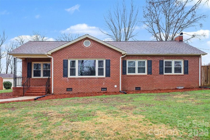 Welcome to 1008 Edgewood Road! A beautiful brick home in Bessemer City, NC featuring two bedrooms, one full bathroom, and an additional spare room on over an acre. You'll be welcomed through the front door by a large living area that leads into a hall to the kitchen dining room and den. Off the kitchen you will find french doors that lead up out into the large entertainers back yard.  This property has something for everyone, with the rolling front yard and level fully fenced back yard you'll never run out of space to play or entertain outdoors. The backyard boasts a large porch ready for a new above ground pool. The property has many fruit trees as well as a detached garage, a storage building and a large workshop. This home also features concrete driveway with ample parking in addition to the detached garage previously mentioned. Come see this home today and don't miss the opportunity to own this sweet piece of Bessemer City!