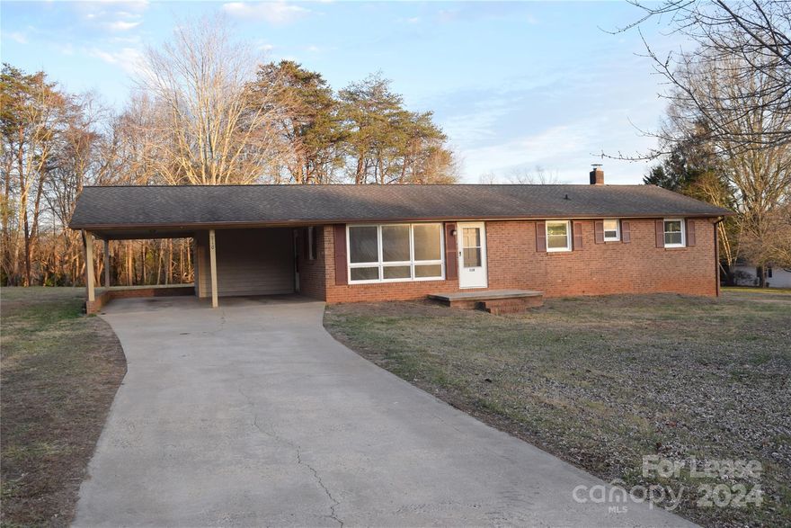 Available Now! All brick ranch with full unfinished basement on 1 acre lot.  Lots of space in this rancher!  Nice flat yard bordered by trees in the rear.  Plenty of space for your garden!  Double carport.  Front living room with large picture windows. Dining area opens to a white kitchen with breakfast bar. Primary bedroom with joining half bath plus two bedrooms that share the hall bath.  Full unfinished basement with side exterior door.  Beautiful country setting in established neighborhood.  Convenient location, 5 minutes from downtown Taylorsville. 9 minutes from Walmart on Highway 90.  26 minutes to Statesville and 28 minutes from Conover.