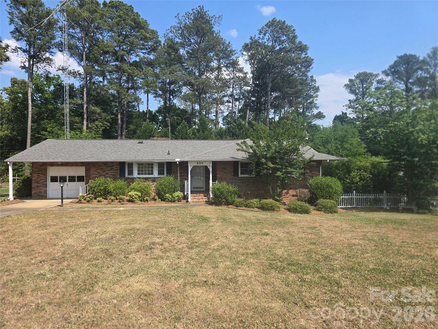 IMPROVED PRICING! Beatuiful brick ranch home , with lovely landscaped yard, nestled on .40 acre! Enter through the front foyer, you can enjoy the flex room to the right, that can be used as your choice. Enjoy cooking in your spacious kitchen as you  look out the large bay window and enjoy the beauty of the seasons. Custom cabinets with a built in pantry with slide out drawers and slide out trash can, Bead board cabinets, tons of cabinet space. A kitchen lovers delight! Spacious living room with custom built shelves and a fireplace with gas logs. Large laundry room with custom built cabinets and shelves, perfect for the avid hobbyist or could be used for an office area. Venture to the full length sunroom that you can enjoy throughout the year.  Move on to the spacious backyard with the covered patio where you can have family gatherings and enjoy the outdoors. The gas pack is approximately 8 yrs old. This home is ready for the new homeowner to make it their own.  The home is being sold AS IS.  COUNTY TAXES ONLY! Behind Walmart and is in an  establsihed neighborhood but minutes to shopping, restaurants, schools and hosptial. Waiting for the perfect buyer, and as you turn the key to your new home, you feel as though it is saying , WELCOME HOME!