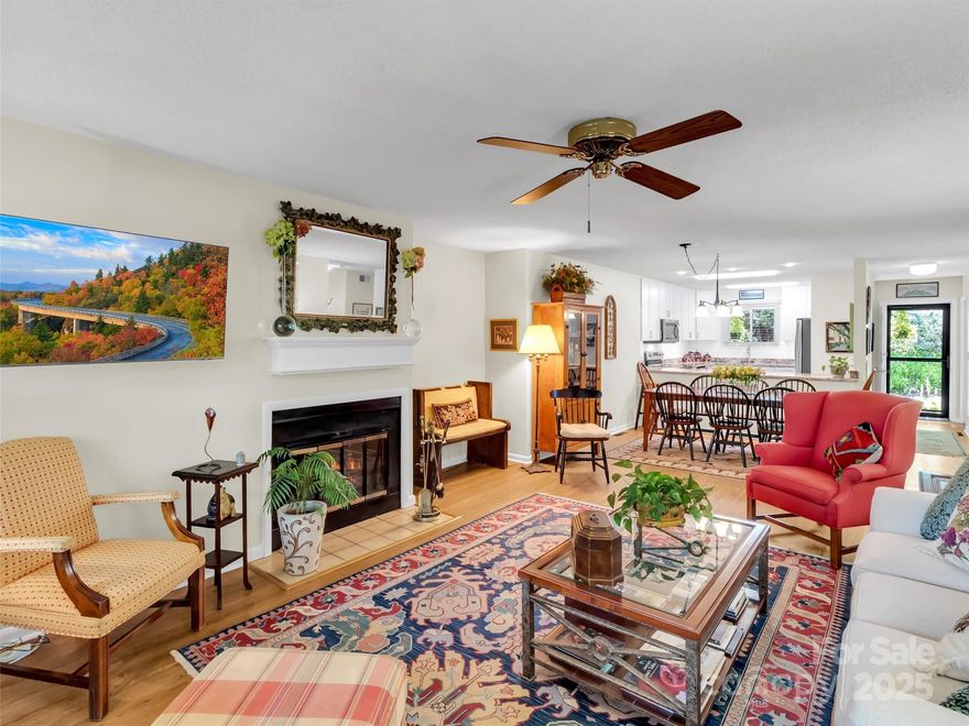 Discover comfort & style in this spacious bottom-level condo featuring 3 bedrooms & 3 baths. This unit boasts a completely remodeled kitchen (2024) with beautiful granite countertops, new cabinetry with soft-close drawers, new appliances & a beverage cooler—perfect for entertaining or everyday living. Enjoy the updated primary bath, designed with today’s finishes for a fresh, luxurious feel with a large step-in shower & two sinks. Open floor plan, 2 wood burning fireplaces & wonderful porch to savor the VIEWS & mountain breezes. This condo has the flexibility & comfort with a lower-level family room perfect for entertaining or relaxing. Enjoy the convenience of having not just one, but two primary suites, providing the ultimate privacy for guests! With thoughtful upgrades & a desirable location at The Greens, this condo offers the perfect blend of convenience & modern living.  New HVAC system in July 2025. Say goodbye to the burdens of yard work & exterior maintenance & embrace a "lock & go" lifestyle! Enjoy the community pool & clubhouse. Just minutes to Waynesville Inn & Golf Club & downtown Waynesville!