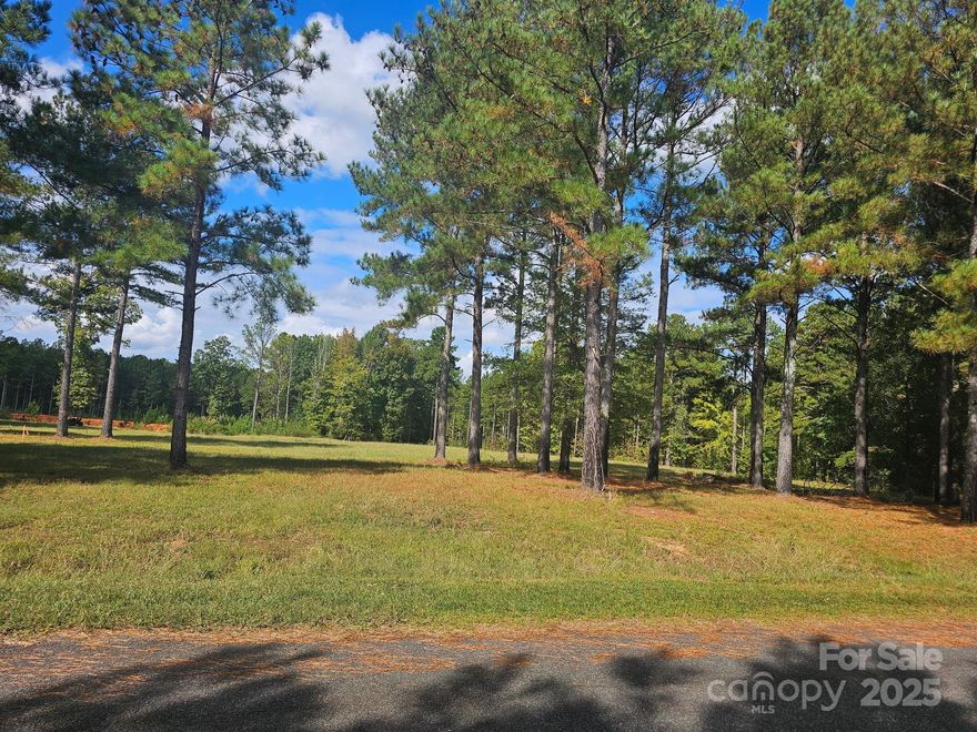 Beautiful 2-acre parcel of flat, cleared land ready for your dream build or creative vision! Located on a quiet country road yet just minutes from I-85 and downtown Concord, this property offers the perfect blend of peace, privacy, and convenience. The land is open and level with beautiful mature pine trees along the border, providing natural privacy without blocking the views. Ideal for building your custom home, barndominium, or mini-farm with plenty of space for horses, gardens, or outdoor living. Enjoy the freedom of no HOA and easy access to Concord, Harrisburg, and Charlotte. This property is a rare find — a perfect setting for your forever home or opportunity in a growing area of Cabarrus County.