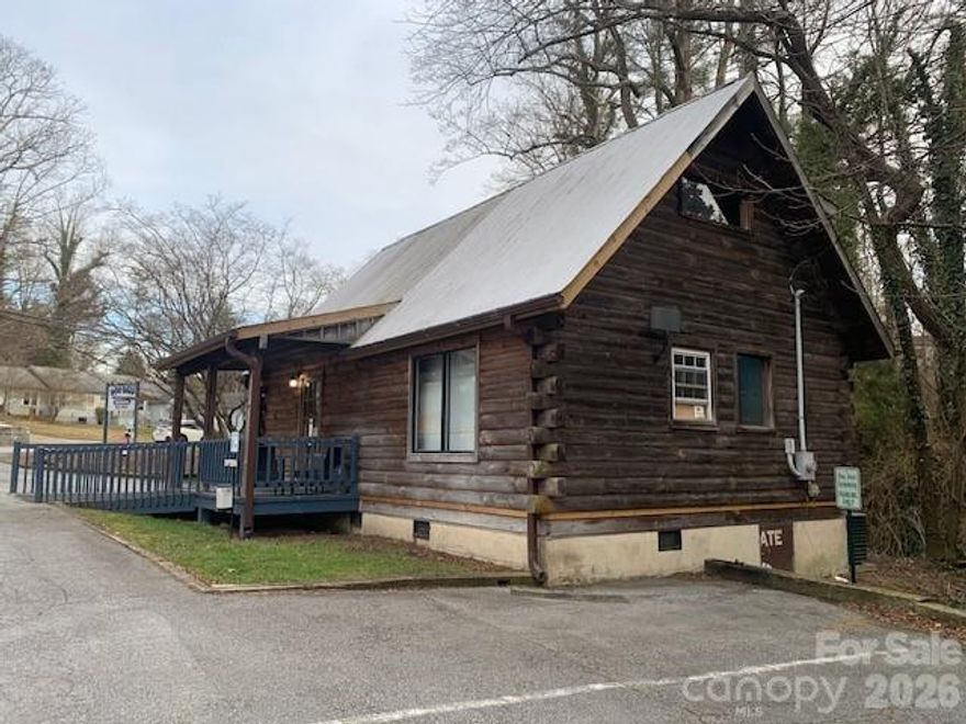 1001 & 1003 prestigious GREENVILLE HWY, only blocks from HISTORIC DOWNTOWN HENDERSONVILLE.  
Pride of dynamic LOCATION, QUALITY and VALUE ... available NOW with possible EASY OWNER FINANCING.
   This property is offered in two ways, THIS OFFERING IS THE TOTAL; TWO BUILDINGS WITH THE TOTAL TRACT OF LAND (0.64ACRE) at $995,000. THIS LAND IS NOT IN ANY FLOOD PATTERN!!! Most of the land throughout this area IS ... BURDENED WITH A FLOOD ISSUES, this is high and dry.
    BUILDING #1: SEE the pictures, includes the MAIN BUILDING with some 2,310 SF finished UPSTAIRS/MAIN LEVEL ""PLUS"" AN ADDITIONAL LOWER LEVEL (with parking) another 2,310 SF to modify as you wish, THAT IS A USEABLE 4,620 SF ... LOWER LEVEL maybe another business, OR expand from upstairs use). Each level has a FULL BATH (toilet, shower and sink), the lower level is about half finished flooring and finished concrete, READY TO USE, come and see it, I will help.
    BUILDING #2: ALSO SEE: a Favorite GENUINE LOG (A-FRAME STYLE) STRUCTURE, is cute and small approx. 720 SF with lots of glass. Everybody loves this LEASED BUILDING AND 4 PARKING SPACES. This is a long-term TENANT WITH INTENTIONS TO STAY PER LEASE CONTACT, immediately $$$ rental income, later for you.
     PUT YOUR DREAMS TO WORK, with very favorable ZONING OF (GHMU) GREENVILLE HIGHWAY MIXED USE. Of course, always verify with authorities all details and uses.  Historically used as HENDERSONVILLE VETERINARIAN, EVERYTHING IS IN GREAT ORDER OR USE.  CALL AND MAKE APPOINTMENT TO SEE AND DREAM, ETC.  This has a great variety of uses, great business center with offices, or retail ... maybe a Diner or Restaurant ... Look at the success of all businesses on this US HWY 25 SOUTH, seems meant for Special Gathering of Boutic Business of very high caliber, IF YOU WANT A 5 LANE AND FAST FOOD GO FOR IT ... But seems HENDERSONVILLE AND FLAT ROCK ENJOYS a slower pace, seems center of SUCCESS.  LET'S TAKE A LOOK.  I have owned two properties only blocks from this with GHMU AND C-3 ZONING, BOTH VERY SUCESSFUL, HAPPY TO SHARE MY EXPERIENCES. DON'T FORGET THE "RARE OWNER FINANCING CONSIDERATION".