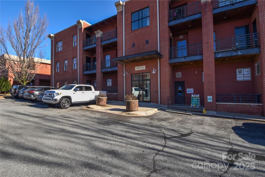 An exceptional opportunity to own or lease a versatile commercial office condo in a prime Cornelius location, ideal for professionals, entrepreneurs, or investors seeking a strategic and cost-effective workspace. Easily accessible to Highway 77, this centrally located office allows you to conveniently serve clients throughout the Lake Norman area. This well-maintained unit offers a professional layout suitable for a wide range of uses and has previously served as a real estate office for a top-producing team of eight agents. The space features a functional two-room configuration allowing for two private offices and a large meeting room or open workspace. Two bathrooms provide added convenience for both staff and clients, while a full kitchen enhances daily operations, team use, and extended work hours—making this office both efficient and highly functional. The unit may be purchased or leased and is available fully furnished, providing a turnkey opportunity for immediate occupancy.