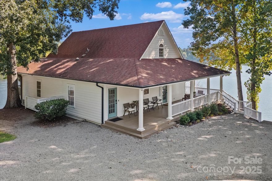 Exceptional waterfront property offering some of the best views on Lake Norman with over 380' of shoreline! This picturesque home is set on a private point allowing for magnificent water views from almost every room. Private DOCK and fully renovated beautiful home. Enjoy 3 bedrooms and 3 1/2 bathrooms plus an extra bonus room and office. Extra wide, rocking chair porches create outdoor living space that's perfect for relaxing and taking in the year round water views. The PRIMARY BEDROOM is on the MAIN LEVEL with sliding doors that access it's own screened porch. The ensuite bathroom has a spacious shower and double vanity. The kitchen is open to the dining area and Great room. A nice flex space on the main floor makes a great office or extra guest room. An additional full bathroom on the main floor is perfect for family and friends coming in off the lake. A floating staircase leads upstairs to two more bedrooms, a full bathroom and a recreation room. Keep your boat at your private dock and enjoy launching the kayaks and paddleboards that convey on day 1. There's also a covered sitting area on the pier.  This beautiful property is currently an income producing luxury short term vacation rental but would also make a terrific primary residence or a great vacation home. No HOA. Close to wonderful new retail, and dining at the Villages at Sherrills Ford. Selling Fully Furnished. Move in ready!