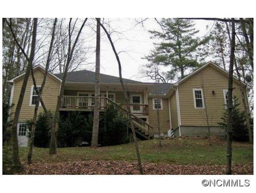 Custom home built in 2005. Private location, well off road, but less than 5 min. to great schools and shopping. This home features an open floor plan, huge great room with gas fireplace, beautiful hardwood floors, delightful master suite with jacuzzi tub and separate shower. The level has large family room with gas fireplace, 4th bedrooom or office & tons of storage or workshop space. Large back deck and private back yard. Glen Arden district!