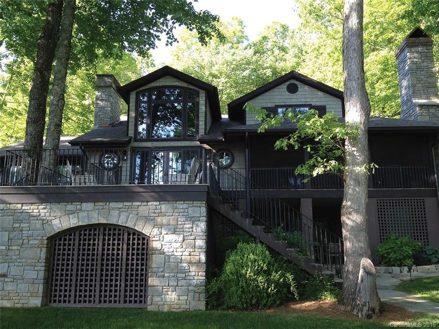 One of Lake Toxaway's most desirable lakefront homes and settings. This completely remodeled lakehouse is situated on a flat site with magnificent, expansive view of Lake Toxaway and Toxaway Mountain. Hardwood floors, stone fireplace, well equipped kitchen including Viking range and cooktop, additional guest areas, and large screened porch with fireplace overlooking Lake Toxaway make this home the perfect choice.