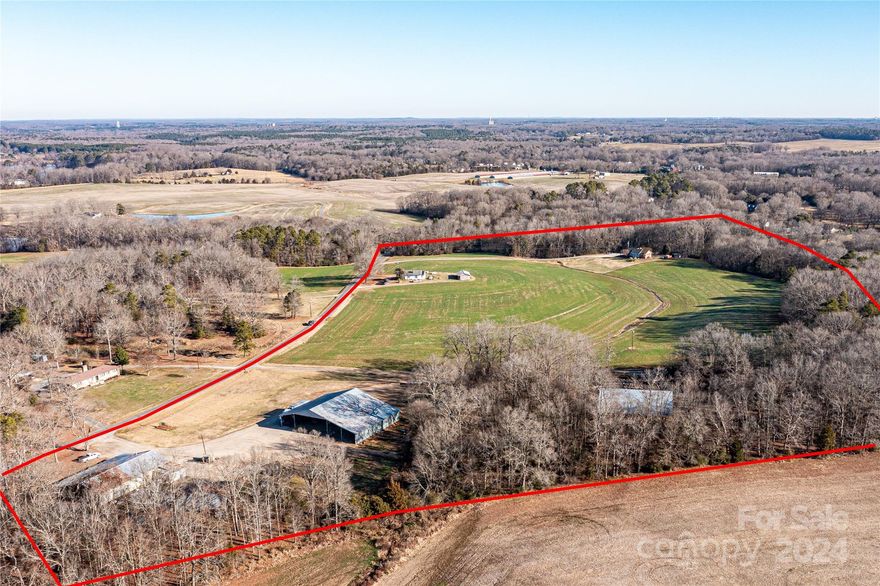 44 ACRES with operating farm, 2 homes, workshop, multiple pole barns, stream, and tons of potential! Come to the country and build your family compound. Live and work on this successful farm that has operated in the same family for over 100 years! Endless possibilities with this gorgeous slice of country heaven. 3 septic systems, 3 wells, and three homesites. The homesite in woods has an old manufactured home that needs lots of work. Ideal for building site of a new home. The brick home has a full basement, heated and cooled, and offers a walkout. Main floor is remodeled and gorgeous! Call today for your preview!