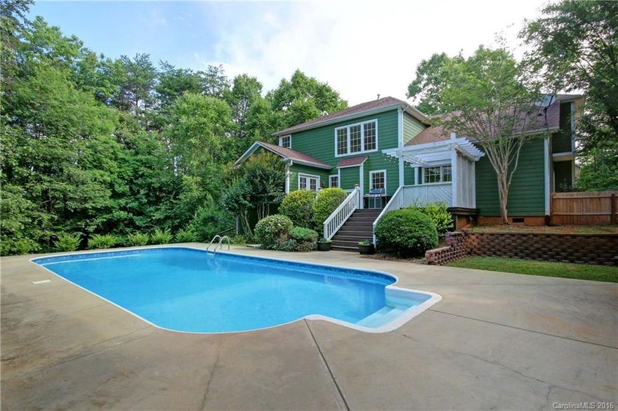 LAKE ACCESS and NO HOA.  Serene and private 4 BR + bonus 2.5 bath on 1 acre w/ in ground pool. Loads of natural light, view of trees from all the windows, and super private outdoor living and pool area. Boat ramp, pier and beach at community lake access.   5 min drive to award winning schools. Warm and inviting, this home has been updated in the last year.  Hardwoods on main, two-story great room, master suite on main, office, sunroom, 3 more BRs plus bonus or 5th bedroom. Take VT for all photos