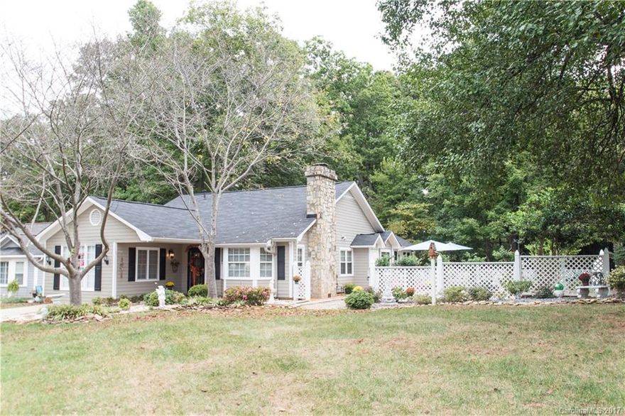 Lush home with lots of bells and whistles! Hand-scraped wood floors throughout home, tile in baths, unique features around every corner. Vaulted GR with gas logs, huge MB with sitting area, jacuzzi bath tub with double shower heads, surround sound throughout home, bird viewing in the sunroom with gas log furnace, quiet back deck, lovely fenced courtyard with stone features, low e coating argon windows, Hunter ceiling fans in all beds, living room and kitchen, programmable door lock and doorbell!