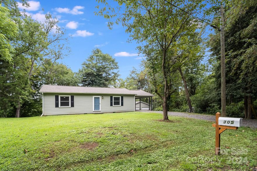 Welcome to your dream home! This beautifully remodeled single-level gem was fully updated in 2021 and is ready for you to move. Sitting on a large private lot, this 3-bed, 1-bath home features modern fixtures & stunning wide-plank flooring. Updated kitchen, complete with 2021 cabinetry, a stylish backsplash & stainless steel appliances. Adjacent to the kitchen, you'll find a convenient laundry/mudroom, perfect for dropping off your shoes & keeping things tidy. The spacious bedrooms are adorned with cozy carpet & the charming bathroom adds a touch of character. Outside, the generous backyard provides endless opportunities for outdoor enjoyment and relaxation.
The detached double garage with electric is a versatile space that would make a nice workshop or space for parking your vehicles. With a 2021 roof, well, septic, heating system & hot water heater, this home offers modern comfort & peace of mind. Don't miss out on this move-in-ready haven.