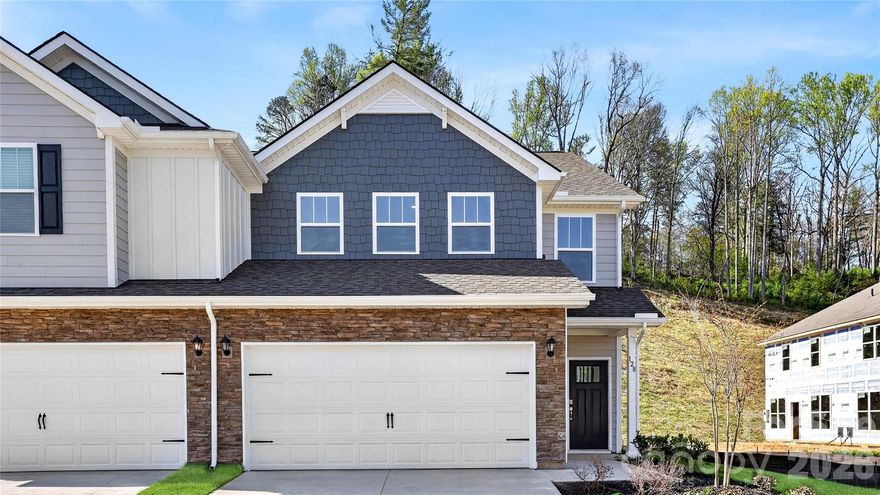 A new townhome community North of Asheville. These low maintenance townhomes offer 2 car garages and are close to everything Asheville has to offer! This floor plan features 4 bedrooms, 2.5 bathrooms and at over 2200 square feet, there is room for everything you need. The primary bedroom is conveniently located on the first floor, with the other three bedrooms and a loft space upstairs. The open floor plan seamlessly blends the living room, dining room and kitchen areas for an open, bright feeling.