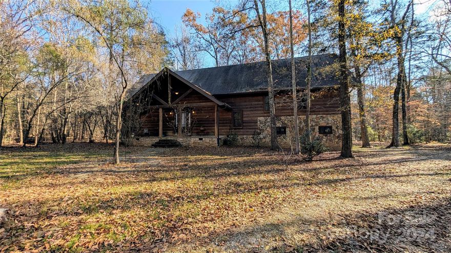 Back on the market due to no fault to the seller!! 
This property has so much to offer starting with PRIVACY due to its wooded landscape and creek surrounding it.  Unique, Gorgeous, Private Custom Built Log Home! This fabulous 4 possible 5 bedroom/3.5 bath home sits on 4.70 acres and has its own security system and a coded front gate. The home is adorned with stone, tile, and hickory hardwood flooring. Fully Professional Grade Chef's kitchen with enough room to cook for a small army. You don't want to miss this amazing house, a true hidden gem!  It's close enough to Charlotte but far enough away to enjoy the fresh outdoors! If the power goes out don't worry, there is a whole house generator! The 1st floor bedroom offers (12-foot ceiling) with step-in closets and a private bath featuring a jetted soaking tub, separate shower for two and a double sink to complete a hard day in luxury. Property is in need of some repairs and is being sold as is.