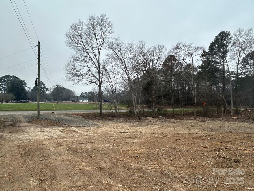 3 acre corner lot (Bill Thompson Rd & Robert H. Kirk Rd) freshly cleared and ready to build your dream home.  Some hardwoods around the perimeter of the road frontage.  Nice area south of the Lancaster Golf course. 1500 square feet minimum stick built or modular home. No mobile homes. Perked for a conventional septic system. Public water available on both roads. New Survey/Plat available.